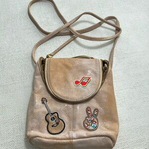 Hobo cute small cross body with music themed embellishments